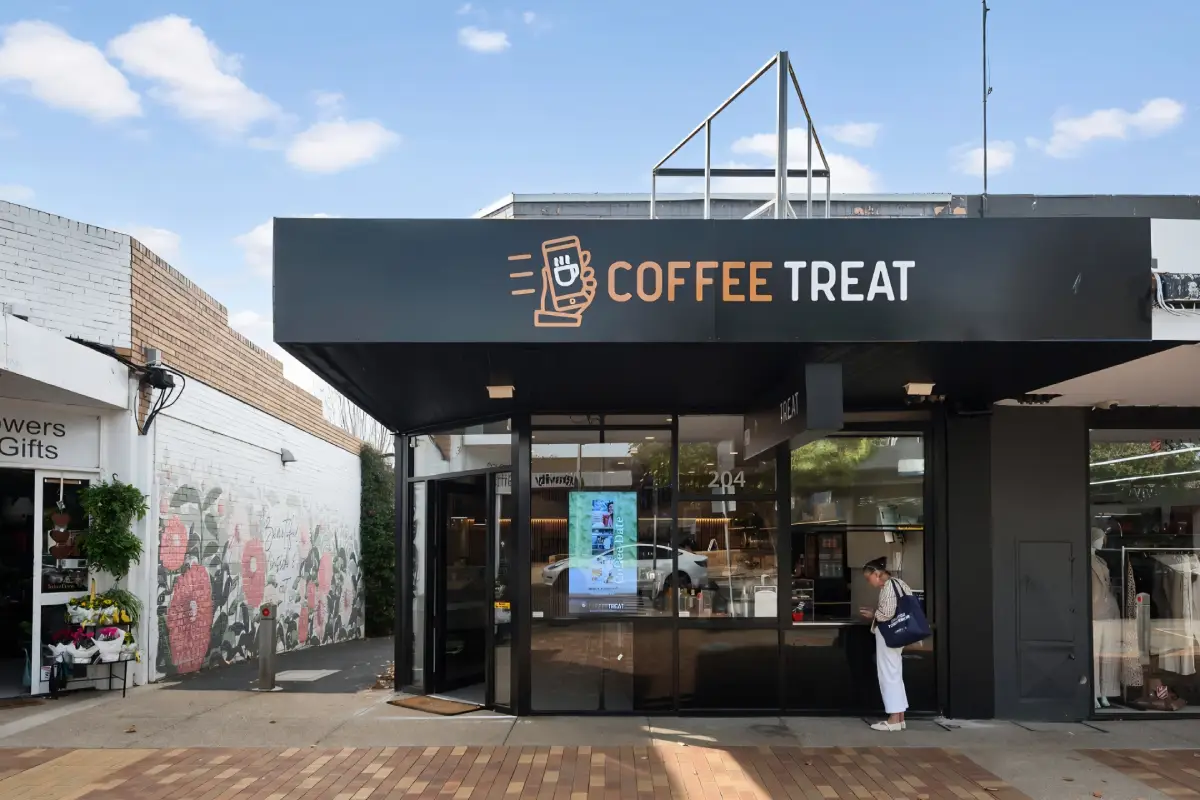 Customer being served at the outside window of Coffee Treat Mornington, 204 Main St